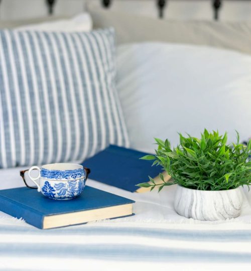 Tea and books in bed - light and bright home decor